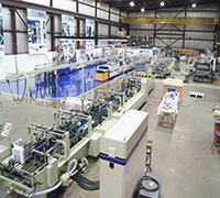 Used packaging machinery and training floor at AIM